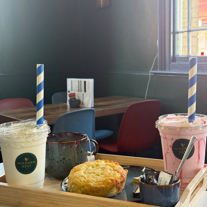 Milkshakes and a cheese scone on a tray