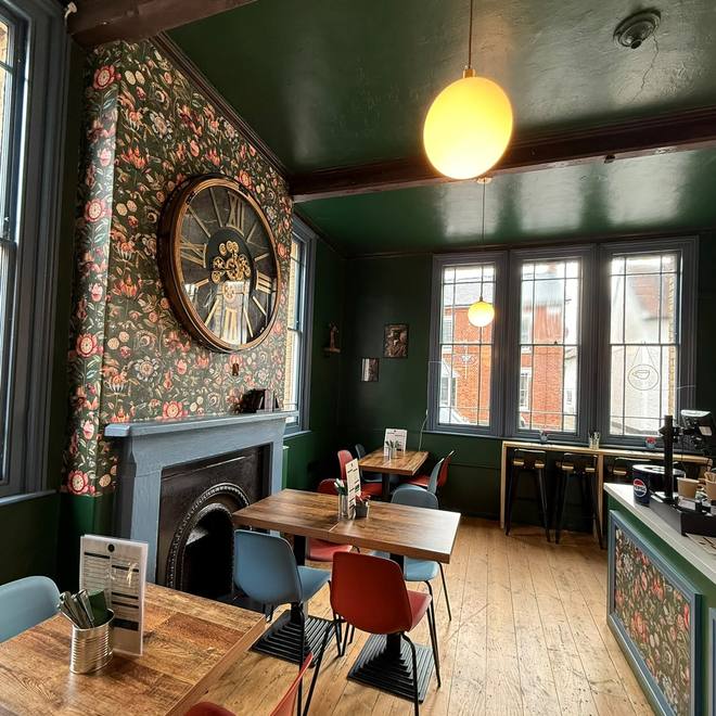 The café interior with its feature clock